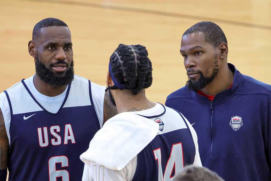 Lebron James Anthony Davis and Kevin Durant talk together on the basketball court