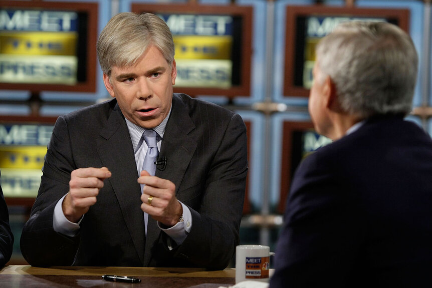 David Gregory (L) speaks as moderator Tom Brokaw (R) looks on during a taping of "Meet the Press"