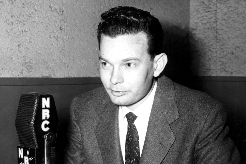 Nightly News anchor David Brinkley talks into a microphone on air