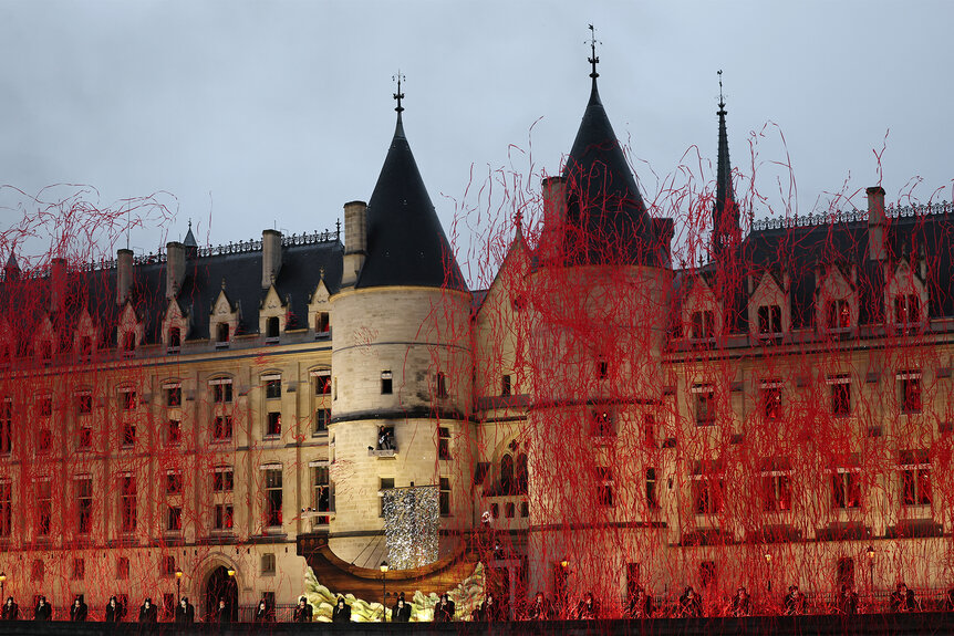 A band performs at the Palais De Justice during the 2024 Olympics Opening Ceremony