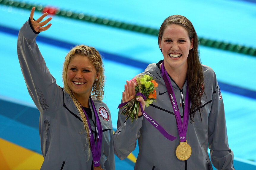 Gold medallist Missy Franklin (R) and bronze medallist Elizabeth Beisel (L) celebrate following the medal ceremony for the Women's 200m Backstroke Final on Day 7 of the London 2012 Olympic Games