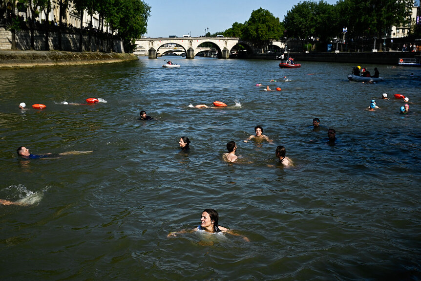 Parisians swimming in the Seine river.