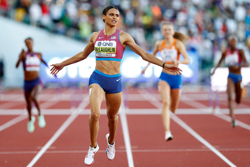 Sydney McLaughlin of Team United States crosses the finish line to win gold and set a new world record in the Women's 400m Hurdles Final