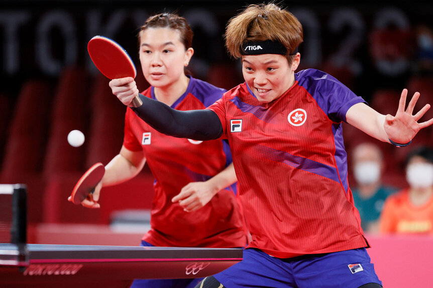 Lee Ho Ching and Doo Hoi Kem of Team Hong Kong in action during their Women's Team Bronze Medal table tennis match on day thirteen of the Tokyo 2020 Olympic Games