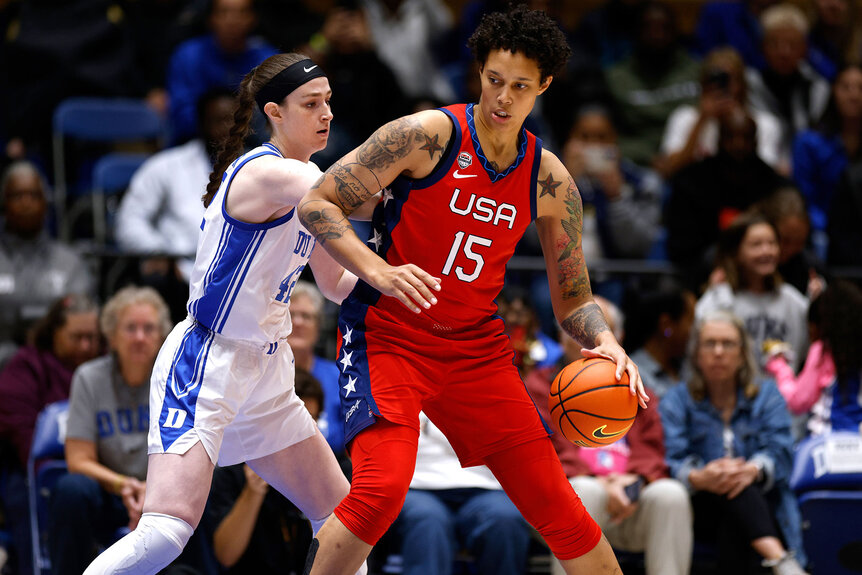 Brittney Griner #15 of the US National Team moves the ball against Kennedy Brown #42 of the Duke Blue Devils during the first half of an exhibition game