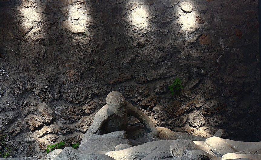 The plaster cast of the corps of a human victim of the 79 AD eruption of the Vesuvius in Pompeii