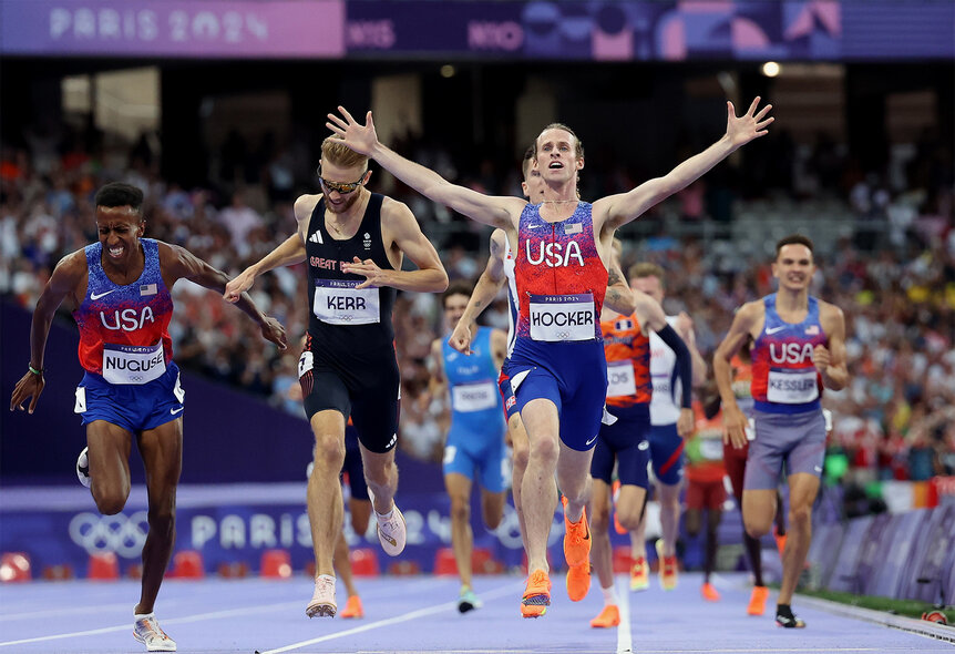 Cole Hocker crosses the finish line and celebrates at the 2024 Olympics