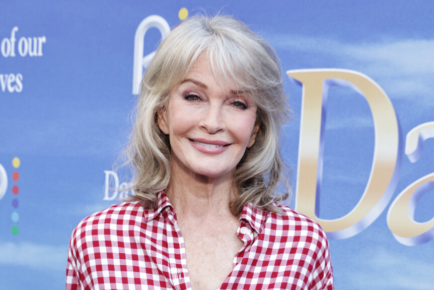 Deidre Hall wears a checkered red and white shirt on the red carpet