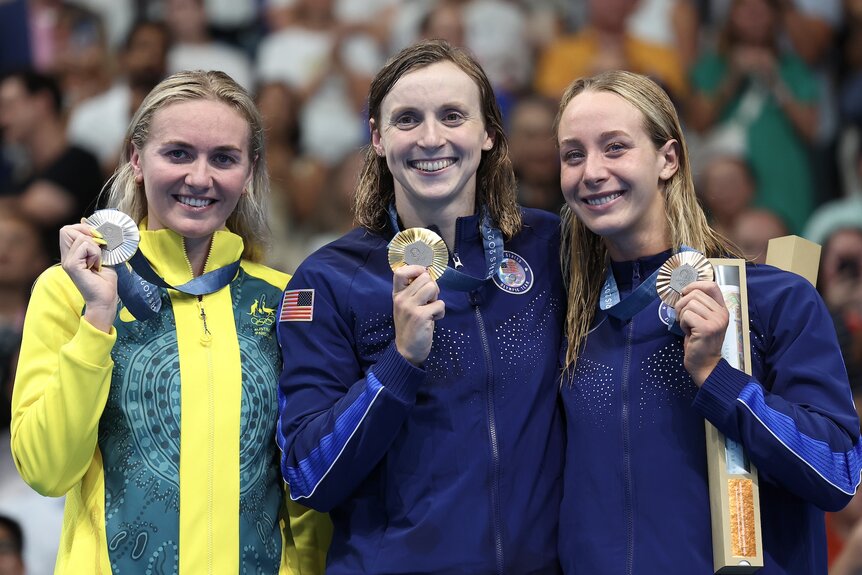 Americans Katie Ledecky and Paige Madden show off their medals at the 2024 Olympics