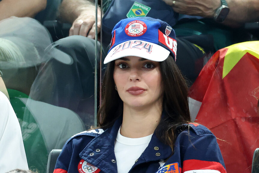 Kendall Jenner sits wearing a usa olympics hat at the 2024 olympics