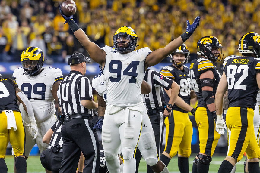 Kris Jenkins of the Michigan Wolverines reacts after a fumble recovery against the Iowa Hawkeyes