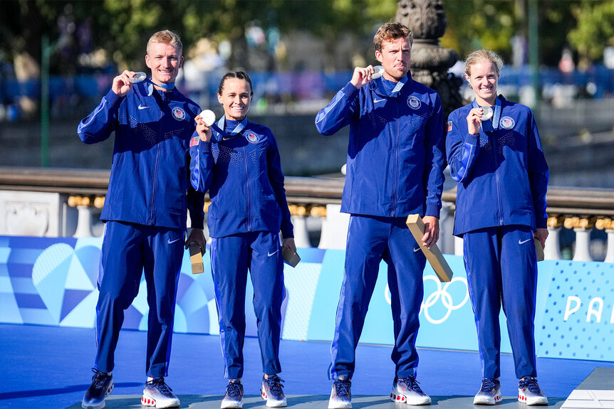 Morgan Pearson of USA, Taylor Knibb of USA, Taylor Spivey of USA, Seth Rider of USA celebrating silver medal during the medal ceremony after competing in the Mixed Relay during Day 10 of Triathlon