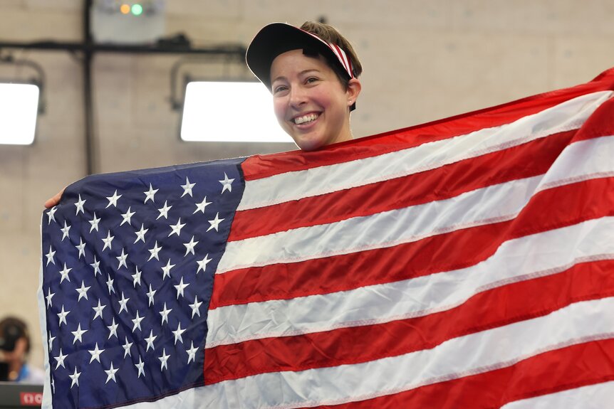 Sagen Maddalena holds up a U.S. flag after winning a silver medal at the 2024 Olympics