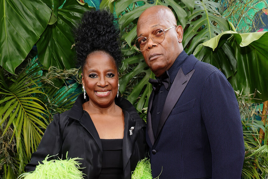 LaTanya Richardson Jackson and Samuel L. Jackson pose together in front of green plants