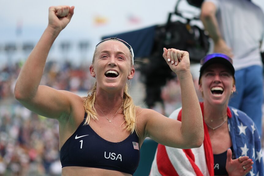 Sara Hughes and Kelly Cheng celebrate at the 2024 Olympics.