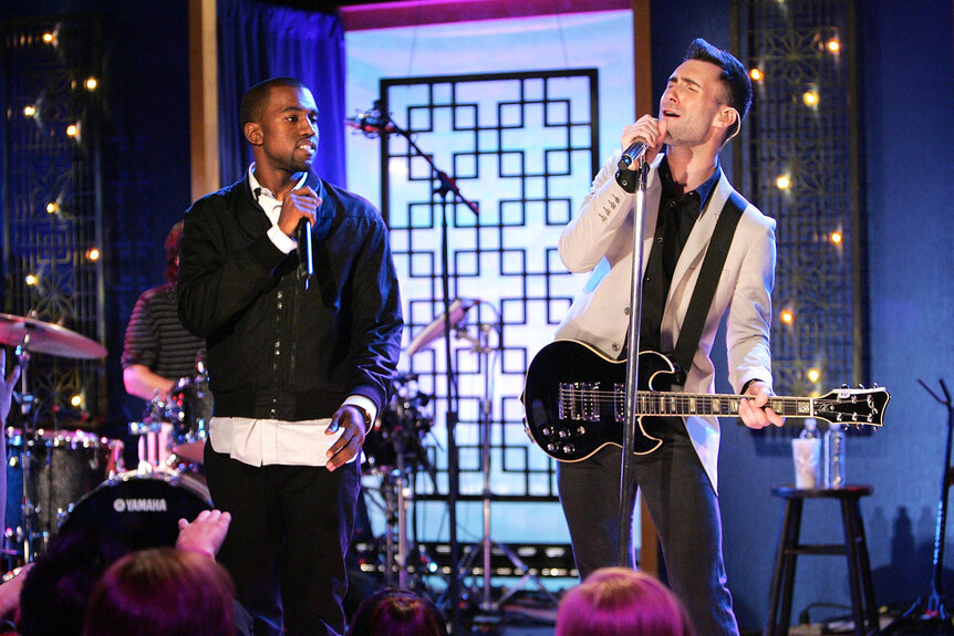 Adam Levine and Kanye West performing together in 2007