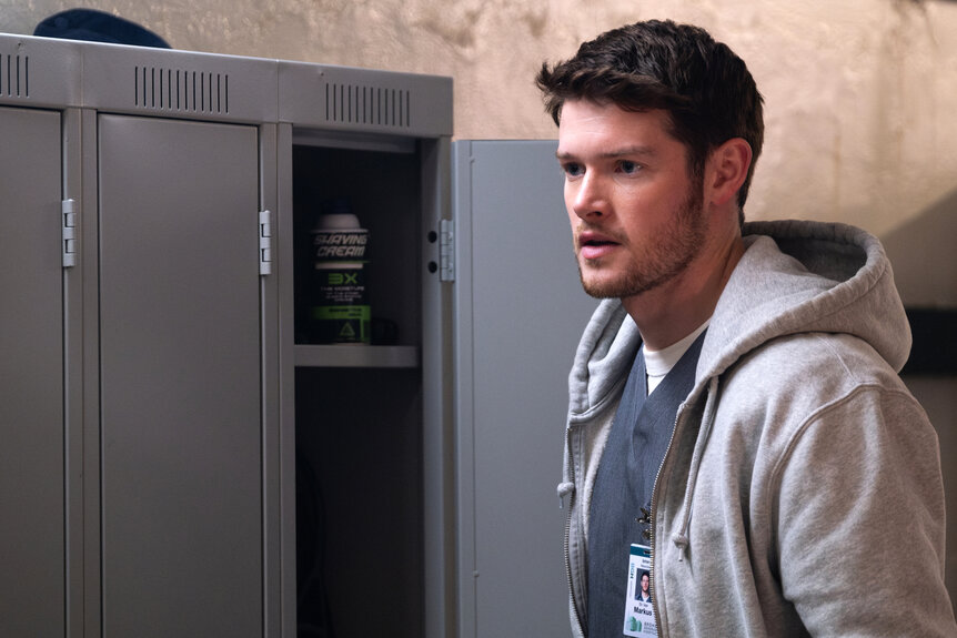 Dr Van Markus stands in front of his locker on Brilliant Minds Episode 101