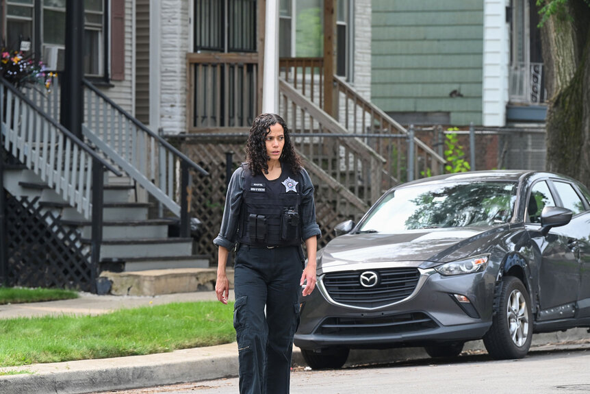 Emily Martel (Victoria Cartagena) crosses the street