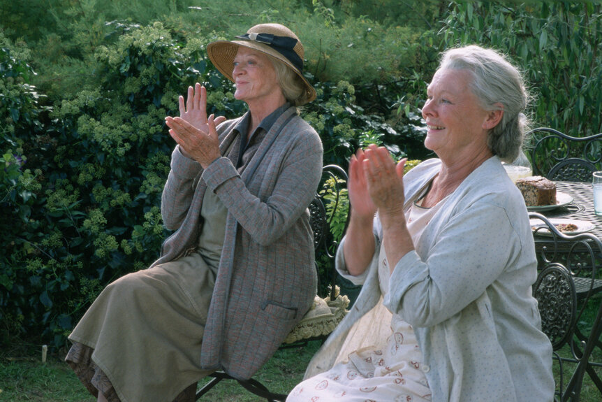 Janet and Ursula clap their hands in Ladies in Lavender