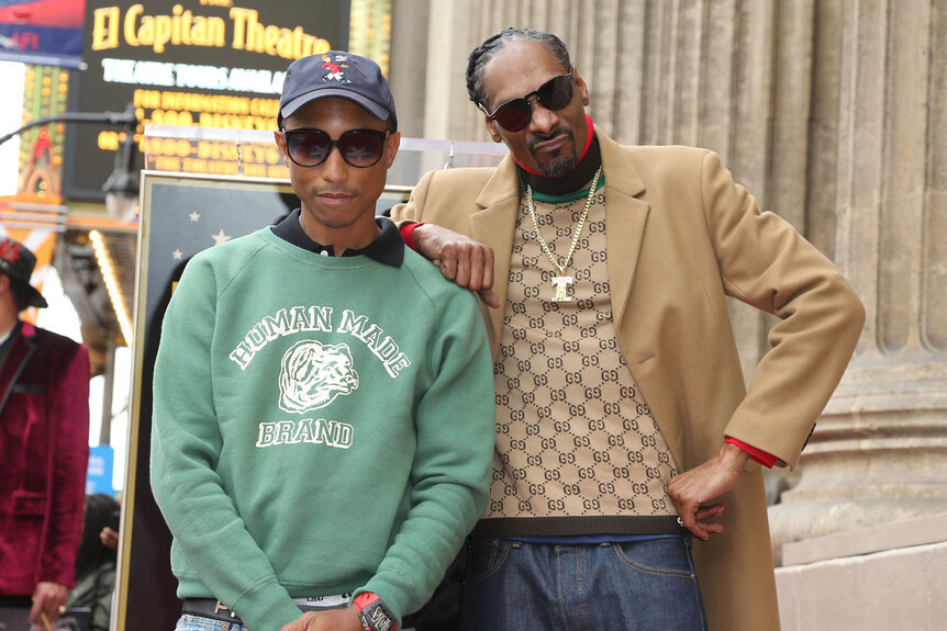 Pharrell Williams and Snoop Dogg pose together at Snoop Dogg's Hollywood Walk of Fame star ceremony in 2018