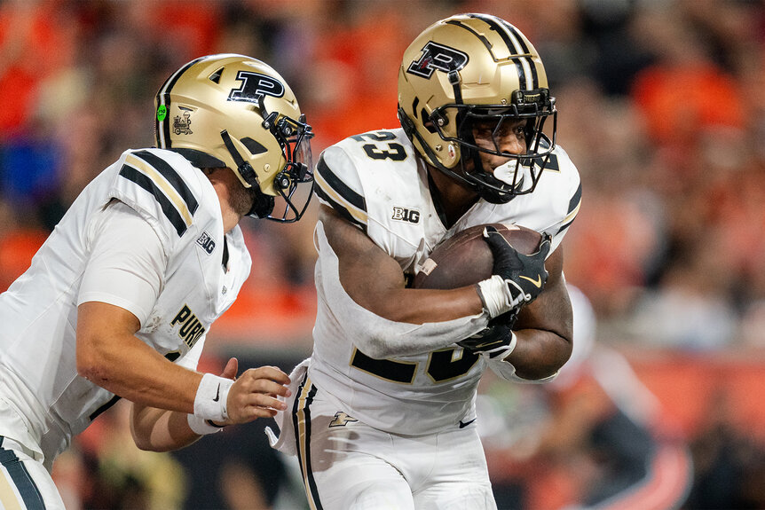 Purdue Football players during a play on the football field