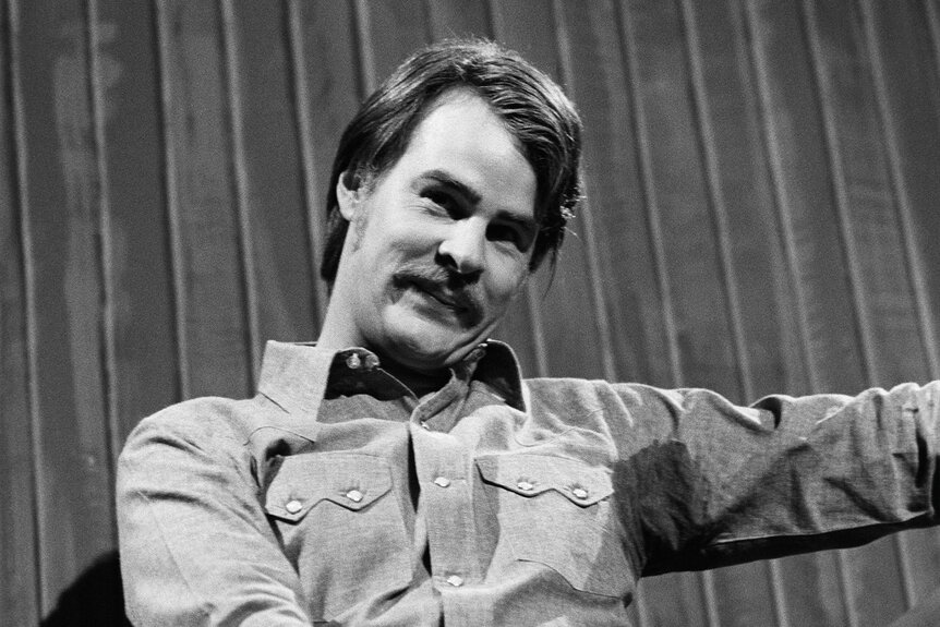 Black and white close up of Dan Aykroyd as Jimmy Carter during the "Carter's Campaign" skit