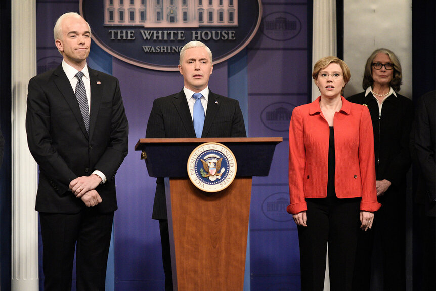 John Mulaney as Joe Biden, Beck Bennett as Mike Pence, and Kate McKinnon as Elizabeth Warren standing together