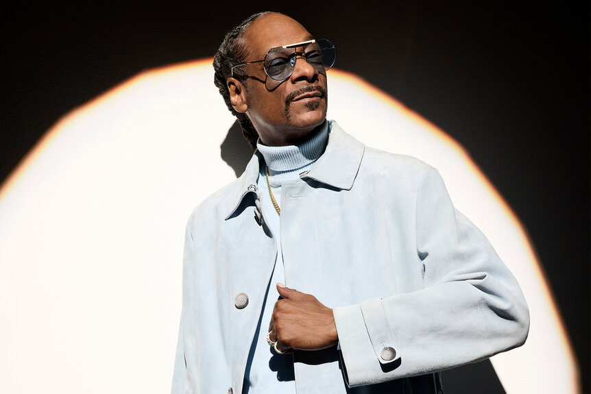 Snoop Dogg wears a powder blue jacket and turtle neck for the voice season 26