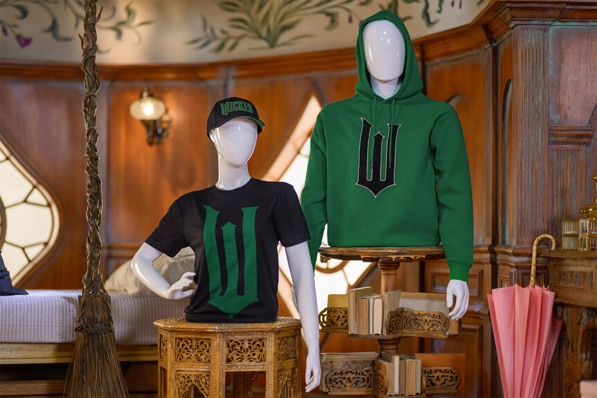 Mannequins wear sweatshirts from The Wicked Experience at universal parks