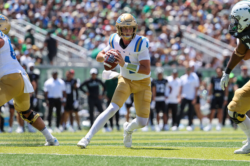 Ethan Garbers of the UCLA Bruins runs the ball during the first half of the game against the Hawaii Rainbow Warriors