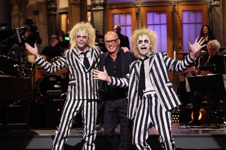 Mikey Day and Andy Samberg dressed as Beetlejuice with Michael Keaton