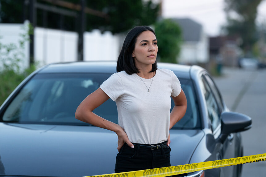 Val Soto stands by police tape with her hands on her hips on Chicago P.D. Season 12 Episode 3.