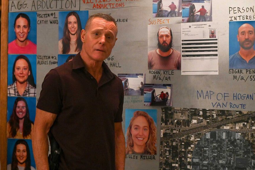 Hank Voight stands in front of a bulletin board on Chicago P.D. Season 12 Episode 4.