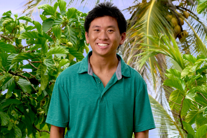 Dickson Wong wears a green polo shirt for Deal Or No Deal Island Season 2