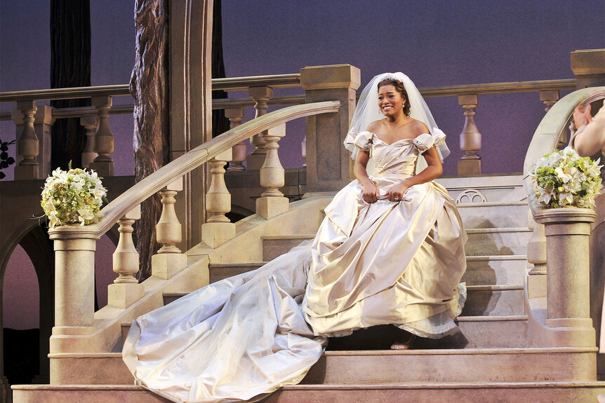 Keke Palmer sits on a flight of stairs in a ball gown during her debut in "Cinderella"