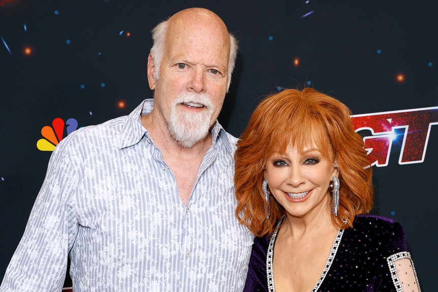 Rex Linn and Reba McEntire pose together on the red carpet for America's Got Talent