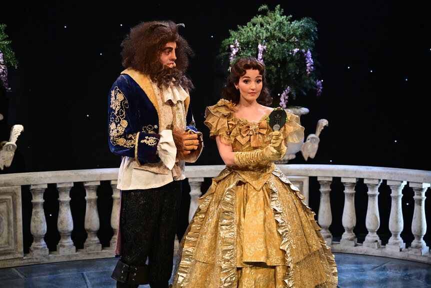 Pete Davidson and Chloe Fineman as belle and the beast on a balcony during Saturday Night Live Season 47 Episode 12