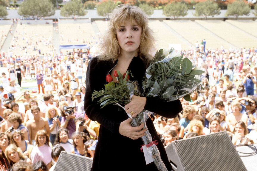 Stevie Nicks on stage with roses at Rock N' Run benefit at UCLA.