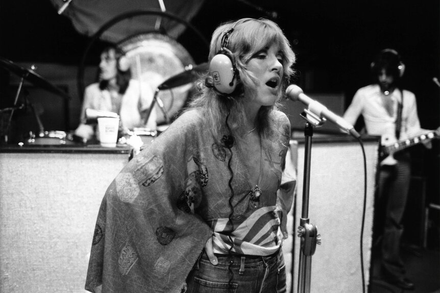 Stevie Nicks singing in the recording studio in 1975.