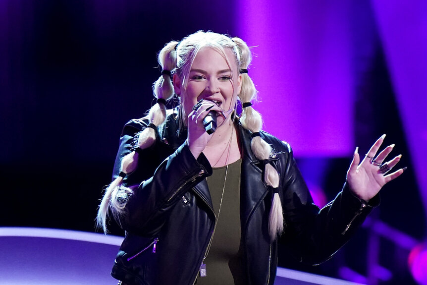 Gabrielle Zabosky sings on stage on The Voice Season 26 Episode 4.