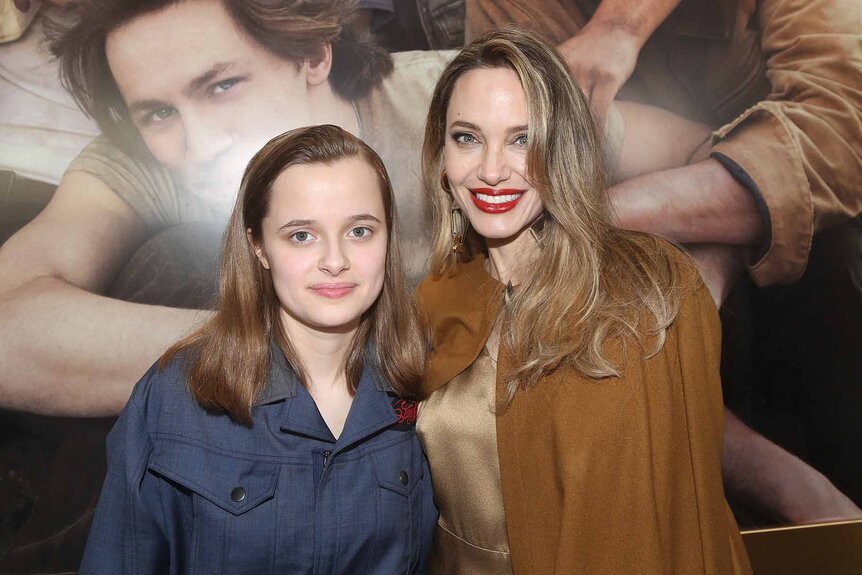 Vivienne Jolie-Pitt and Angelina Jolie smile together.