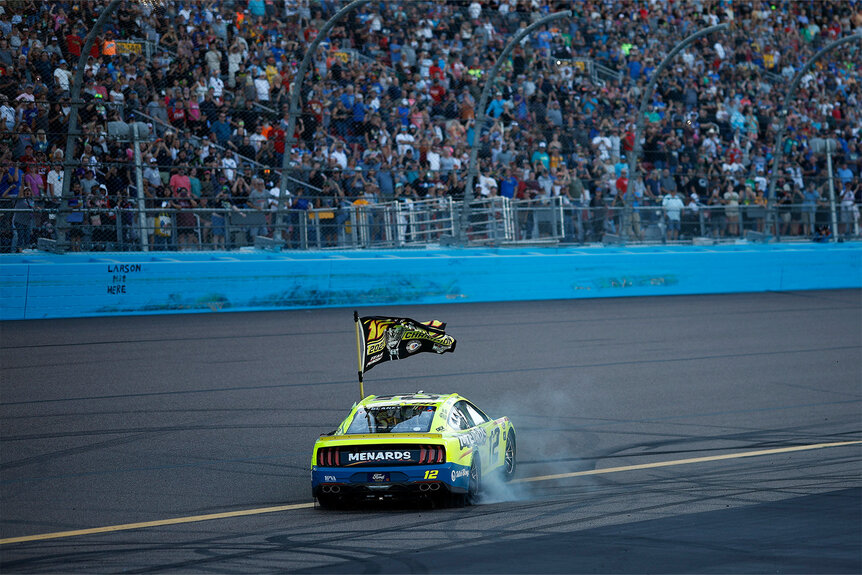 Ryan Blaney, driver of the #12 Menards/Dutch Boy Ford, celebrates after winning the 2023 NASCAR Cup Series Championship