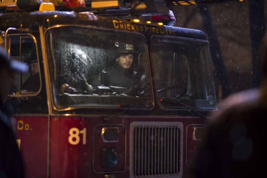 Joe Cruz (Joe Minoso) sits in a fire truck on Chicago Fire Episode 117.