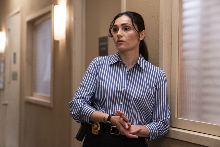 Det. Kate Silva (Juliana Aidén Martinez) wears a striped shirt in Law & Order: Special Victims Unit Episode 26001.