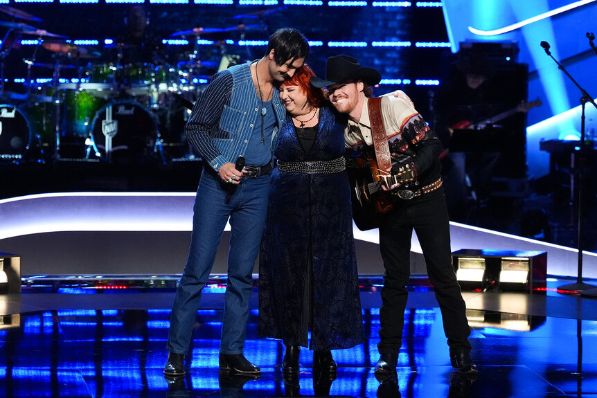 Danny Joseph, Lauren-Michael Sellers and Tate Renner hug on The Voice Season 26 Episode 14