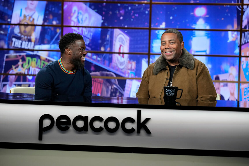 Kenan Thompson and Kevin Hart laughing and talking in 2024's Back That Year Up.