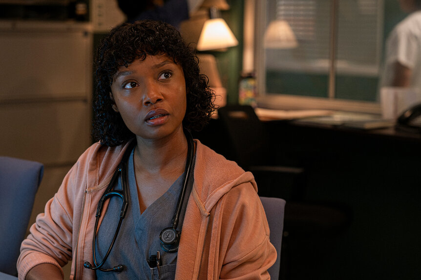 Dr Ericka Kinney looks concerned in a pink hoodie on on Brilliant Minds Season 1 Episode 11.