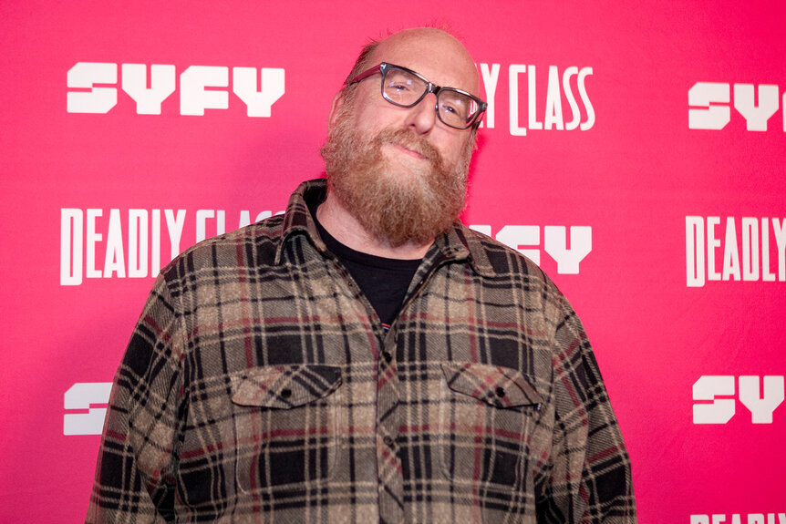 Brian Posehn wears a plaid shirt on the red carpet