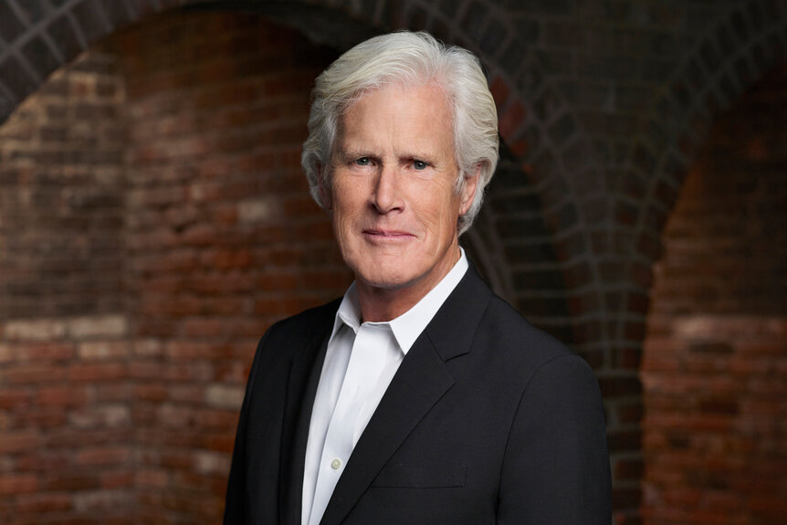 Keith Morrison poses in a black suit for Dateline