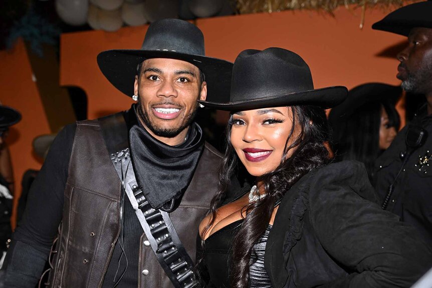 Nelly and Ashanti smile in matching cowboy costumes.